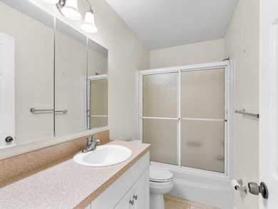 Welcome to this charming 2-bedroom, 2-bath first-floor corner on The American Golf Club in Florida - for sale on GolfHomes.com, golf home, golf lot