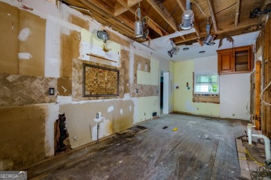 Beautiful spacious fixer upper in the heart of Buckhead.  This on Bobby Jones Golf Club in Georgia - for sale on GolfHomes.com, golf home, golf lot
