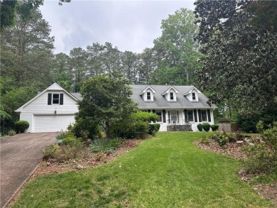This spacious 5-bedroom, 3.5-bath brick home offers strong bones on Canongate At Flat Creek Club in Georgia - for sale on GolfHomes.com, golf home, golf lot