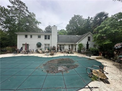 This spacious 5-bedroom, 3.5-bath brick home offers strong bones on Canongate At Flat Creek Club in Georgia - for sale on GolfHomes.com, golf home, golf lot
