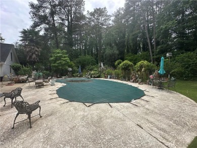 This spacious 5-bedroom, 3.5-bath brick home offers strong bones on Canongate At Flat Creek Club in Georgia - for sale on GolfHomes.com, golf home, golf lot