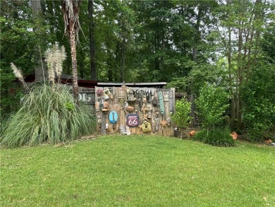 This spacious 5-bedroom, 3.5-bath brick home offers strong bones on Canongate At Flat Creek Club in Georgia - for sale on GolfHomes.com, golf home, golf lot