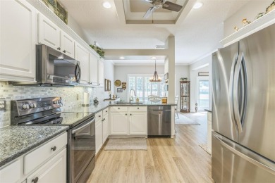 This St. James floor plan backing on the 10th tee of the Kings on Kings Ridge Golf Club in Florida - for sale on GolfHomes.com, golf home, golf lot