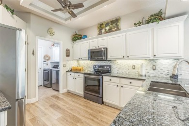 This St. James floor plan backing on the 10th tee of the Kings on Kings Ridge Golf Club in Florida - for sale on GolfHomes.com, golf home, golf lot