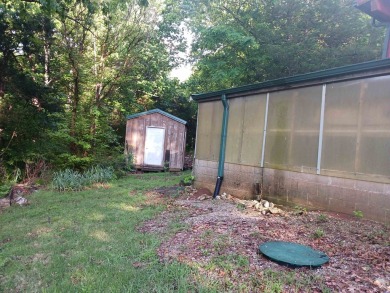 Spectacular view!! This 2/2 home on 2+ acres sits on a bluff on Cherokee Village North Course in Arkansas - for sale on GolfHomes.com, golf home, golf lot