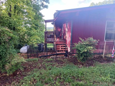 Spectacular view!! This 2/2 home on 2+ acres sits on a bluff on Cherokee Village North Course in Arkansas - for sale on GolfHomes.com, golf home, golf lot