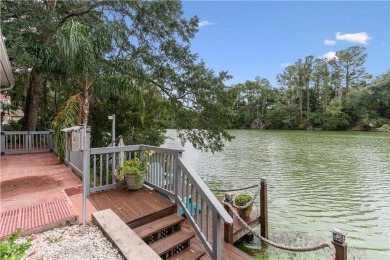 This charming and comfortable bungalow offers beautiful views of on Sea Island Golf Club in Georgia - for sale on GolfHomes.com, golf home, golf lot