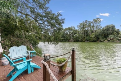 This charming and comfortable bungalow offers beautiful views of on Sea Island Golf Club in Georgia - for sale on GolfHomes.com, golf home, golf lot