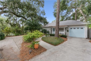 This charming and comfortable bungalow offers beautiful views of on Sea Island Golf Club in Georgia - for sale on GolfHomes.com, golf home, golf lot