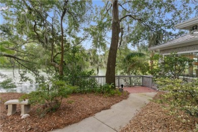 This charming and comfortable bungalow offers beautiful views of on Sea Island Golf Club in Georgia - for sale on GolfHomes.com, golf home, golf lot