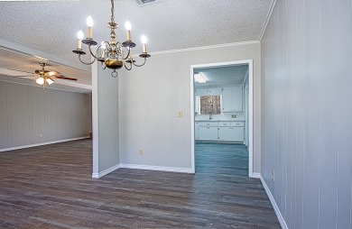 This older home has been renovated .   It has new flooring on Neches Pines Golf Course in Texas - for sale on GolfHomes.com, golf home, golf lot