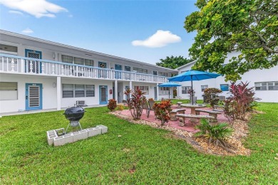 Welcome to this beautifully updated 1-bedroom, 1.5-bath on Hillsboro Pines Golf in Florida - for sale on GolfHomes.com, golf home, golf lot