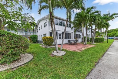 Welcome to this beautifully updated 1-bedroom, 1.5-bath on Hillsboro Pines Golf in Florida - for sale on GolfHomes.com, golf home, golf lot