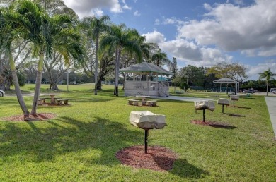 Welcome to this beautifully updated 1-bedroom, 1.5-bath on Hillsboro Pines Golf in Florida - for sale on GolfHomes.com, golf home, golf lot