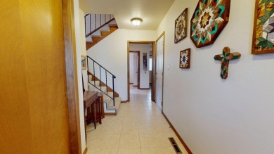 Welcome to this charming, custom-built multi-level home on Cedar Pointe Golf Course in Iowa - for sale on GolfHomes.com, golf home, golf lot