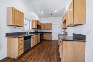 Welcome to 1976 Desert Greens Dr in Fort Mohave AZ, where on Desert Lakes Golf Course in Arizona - for sale on GolfHomes.com, golf home, golf lot