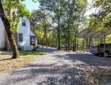 Step inside and you'll immediately notice the thoughtfully on Diamondhead Golf and Country Club in Arkansas - for sale on GolfHomes.com, golf home, golf lot