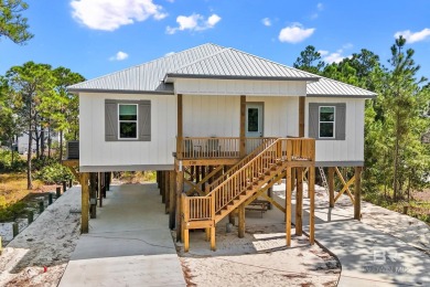 Welcome to your dream coastal retreat in the serene Fort Morgan on Kiva Dunes Golf Club in Alabama - for sale on GolfHomes.com, golf home, golf lot