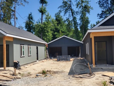 Charming 2-bedroom, 2-bath cottage nestled in a peaceful on Sandpoint Elks Golf Course in Idaho - for sale on GolfHomes.com, golf home, golf lot
