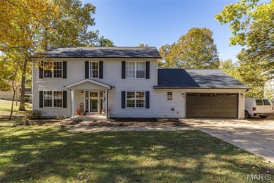 Beautifully updated 2,600 +/- Sq Ft 4 Bedroom, 3 Bathroom home on Raintree Country Club in Missouri - for sale on GolfHomes.com, golf home, golf lot