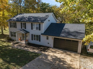 Beautifully updated 2,600 +/- Sq Ft 4 Bedroom, 3 Bathroom home on Raintree Country Club in Missouri - for sale on GolfHomes.com, golf home, golf lot