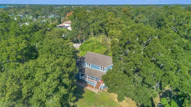 This traditional farmhouse blends Old Florida charm with on Isleworth Golf and Country Club in Florida - for sale on GolfHomes.com, golf home, golf lot