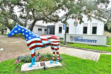 This traditional farmhouse blends Old Florida charm with on Isleworth Golf and Country Club in Florida - for sale on GolfHomes.com, golf home, golf lot