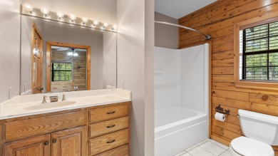 This stunning log cabin, located just moments from Yarborough on  in Arkansas - for sale on GolfHomes.com, golf home, golf lot
