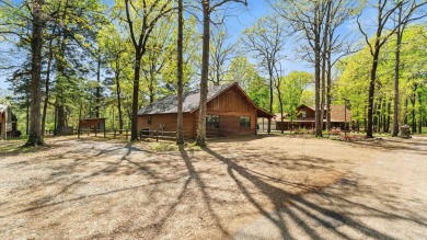This stunning log cabin, located just moments from Yarborough on  in Arkansas - for sale on GolfHomes.com, golf home, golf lot