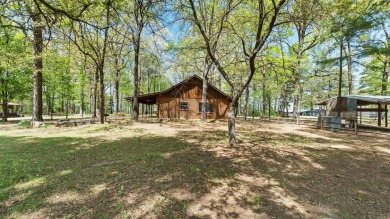 This stunning log cabin, located just moments from Yarborough on  in Arkansas - for sale on GolfHomes.com, golf home, golf lot