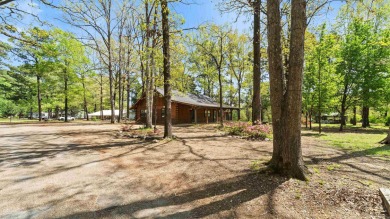 This stunning log cabin, located just moments from Yarborough on  in Arkansas - for sale on GolfHomes.com, golf home, golf lot