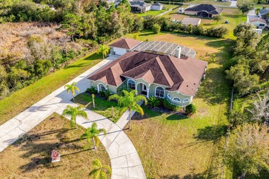 1.03 ACRES | NEWER ROOF & UPDATED MECHANICALS | LUXURY UPGRADES on Wedgefield Golf Club in Florida - for sale on GolfHomes.com, golf home, golf lot