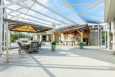 1.03 ACRES | NEWER ROOF & UPDATED MECHANICALS | LUXURY UPGRADES on Wedgefield Golf Club in Florida - for sale on GolfHomes.com, golf home, golf lot