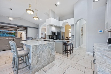 1.03 ACRES | NEWER ROOF & UPDATED MECHANICALS | LUXURY UPGRADES on Wedgefield Golf Club in Florida - for sale on GolfHomes.com, golf home, golf lot