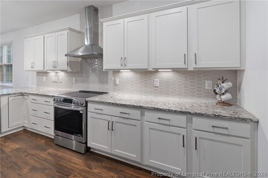 Pristine 2024 Mid-South Club home on an elevated lot with thick on Mid South Club in North Carolina - for sale on GolfHomes.com, golf home, golf lot