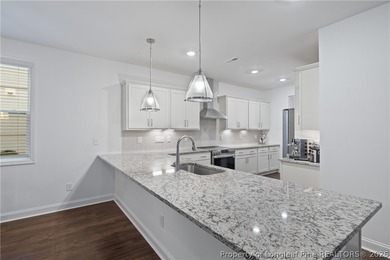 Pristine 2024 Mid-South Club home on an elevated lot with thick on Mid South Club in North Carolina - for sale on GolfHomes.com, golf home, golf lot