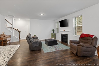 Pristine 2024 Mid-South Club home on an elevated lot with thick on Mid South Club in North Carolina - for sale on GolfHomes.com, golf home, golf lot