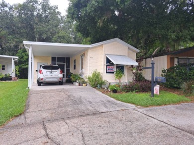Located in a very active 55+ community close to shopping on Golden Lakes Golf Course in Florida - for sale on GolfHomes.com, golf home, golf lot