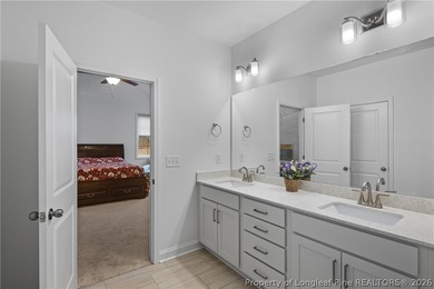 Pristine 2024 Mid-South Club home on an elevated lot with thick on Mid South Club in North Carolina - for sale on GolfHomes.com, golf home, golf lot