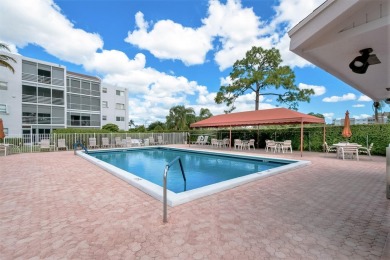 WELCOME TO THIS NATURALLY BRIGHT CONDO WITH SOUTH FACING VIEWS on Poinciana Golf Club in Florida - for sale on GolfHomes.com, golf home, golf lot