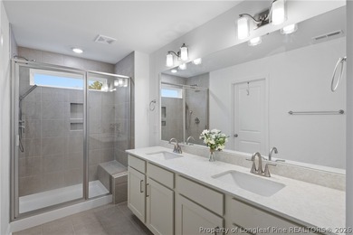 Pristine 2024 Mid-South Club home on an elevated lot with thick on Mid South Club in North Carolina - for sale on GolfHomes.com, golf home, golf lot