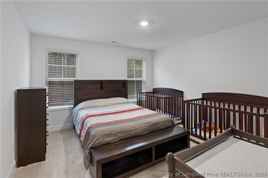 Pristine 2024 Mid-South Club home on an elevated lot with thick on Mid South Club in North Carolina - for sale on GolfHomes.com, golf home, golf lot