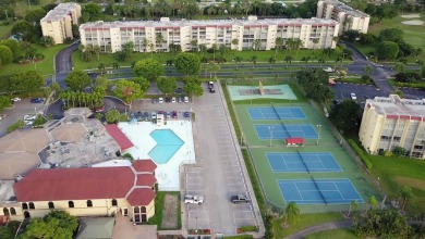 WELCOME TO THIS NATURALLY BRIGHT CONDO WITH SOUTH FACING VIEWS on Poinciana Golf Club in Florida - for sale on GolfHomes.com, golf home, golf lot