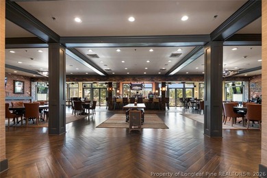 Pristine 2024 Mid-South Club home on an elevated lot with thick on Mid South Club in North Carolina - for sale on GolfHomes.com, golf home, golf lot