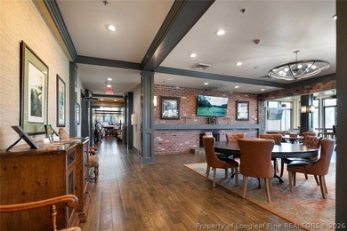 Pristine 2024 Mid-South Club home on an elevated lot with thick on Mid South Club in North Carolina - for sale on GolfHomes.com, golf home, golf lot