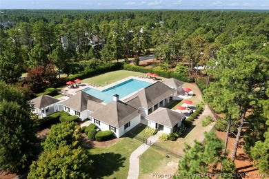 Pristine 2024 Mid-South Club home on an elevated lot with thick on Mid South Club in North Carolina - for sale on GolfHomes.com, golf home, golf lot