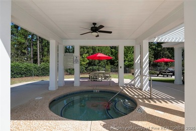 Pristine 2024 Mid-South Club home on an elevated lot with thick on Mid South Club in North Carolina - for sale on GolfHomes.com, golf home, golf lot