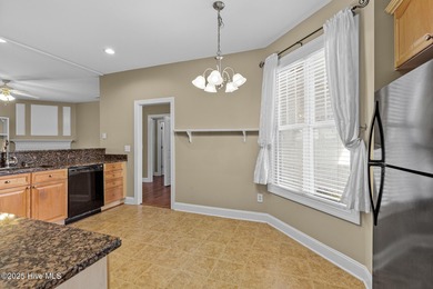 Welcome to a beautifully maintained home in the highly desirable on Magnolia Greens Golf Plantation in North Carolina - for sale on GolfHomes.com, golf home, golf lot