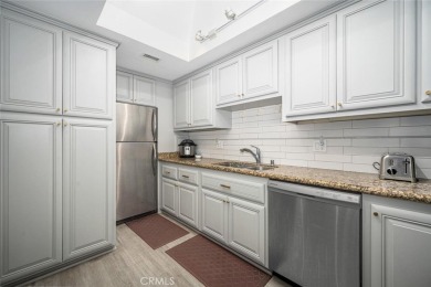 Step inside and be greeted by an expansive open floor plan on Leisure World Seal Beach Golf Course in California - for sale on GolfHomes.com, golf home, golf lot