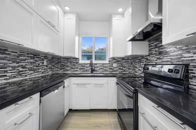 Refined two-story residence in North Coral Gables, set along a on Granada Golf Club in Florida - for sale on GolfHomes.com, golf home, golf lot